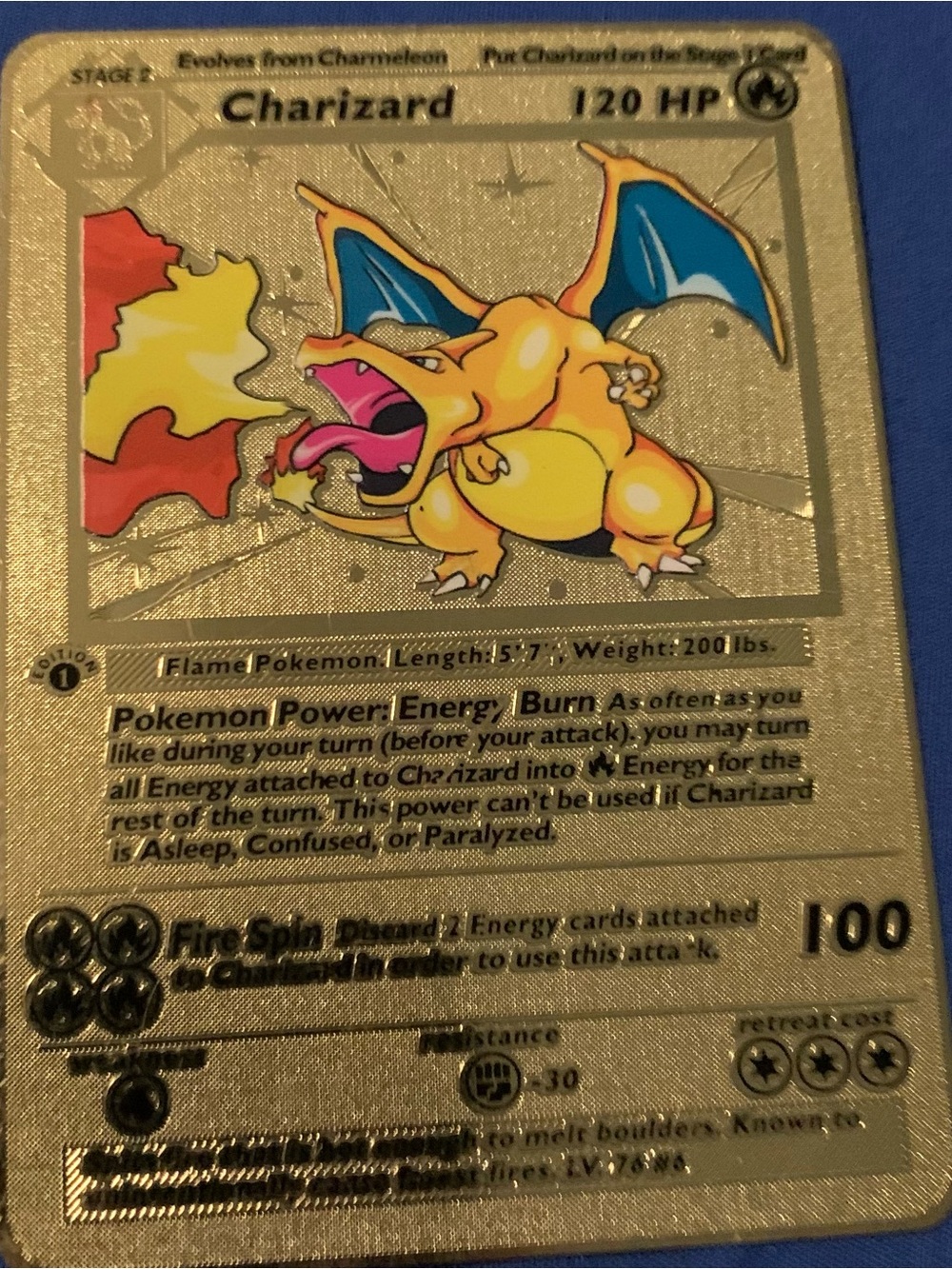 Pokemon Charizard Metallic Gold Card with Blue and Red Accents